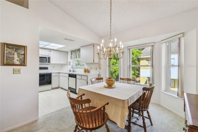 Stunning End-Unit Condo with Pond Views in a Vibrant 55+ on On Top Of The World Golf Course in Florida - for sale on GolfHomes.com, golf home, golf lot