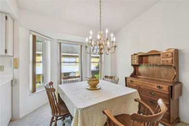 Stunning End-Unit Condo with Pond Views in a Vibrant 55+ on On Top Of The World Golf Course in Florida - for sale on GolfHomes.com, golf home, golf lot