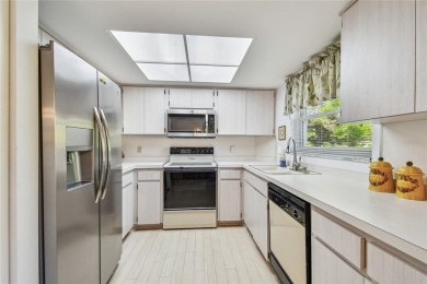 Stunning End-Unit Condo with Pond Views in a Vibrant 55+ on On Top Of The World Golf Course in Florida - for sale on GolfHomes.com, golf home, golf lot