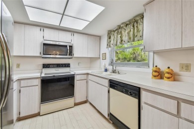 Stunning End-Unit Condo with Pond Views in a Vibrant 55+ on On Top Of The World Golf Course in Florida - for sale on GolfHomes.com, golf home, golf lot
