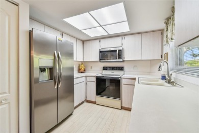 Stunning End-Unit Condo with Pond Views in a Vibrant 55+ on On Top Of The World Golf Course in Florida - for sale on GolfHomes.com, golf home, golf lot