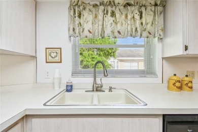 Stunning End-Unit Condo with Pond Views in a Vibrant 55+ on On Top Of The World Golf Course in Florida - for sale on GolfHomes.com, golf home, golf lot