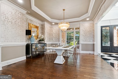 Privately tucked behind a long, tree-lined driveway and greeted on Chateau Elan Golf Club  in Georgia - for sale on GolfHomes.com, golf home, golf lot