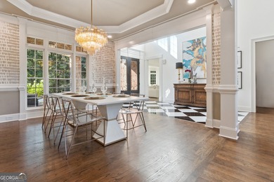 Privately tucked behind a long, tree-lined driveway and greeted on Chateau Elan Golf Club  in Georgia - for sale on GolfHomes.com, golf home, golf lot