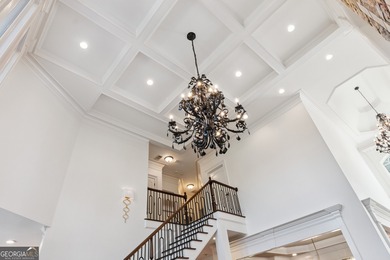 Privately tucked behind a long, tree-lined driveway and greeted on Chateau Elan Golf Club  in Georgia - for sale on GolfHomes.com, golf home, golf lot