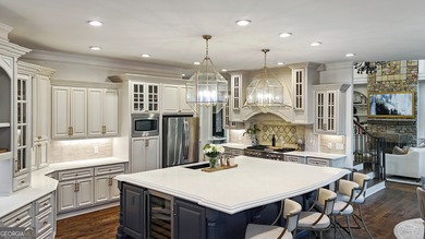 Privately tucked behind a long, tree-lined driveway and greeted on Chateau Elan Golf Club  in Georgia - for sale on GolfHomes.com, golf home, golf lot