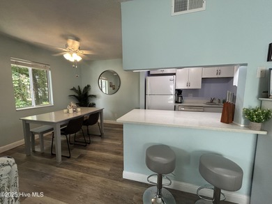 Welcome to this charming 2-bedroom, 2-bathroom coastal condo on Carolina Shores Golf Course in North Carolina - for sale on GolfHomes.com, golf home, golf lot