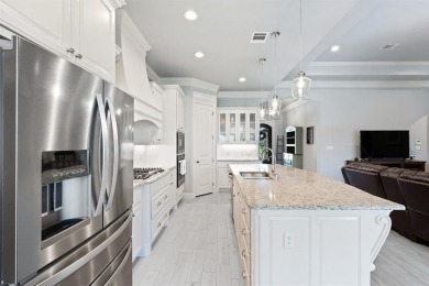 This exquisite four bedroom three bath Al Couto home boasts on Harbor Lakes Golf Club in Texas - for sale on GolfHomes.com, golf home, golf lot