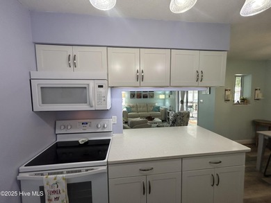 Welcome to this charming 2-bedroom, 2-bathroom coastal condo on Carolina Shores Golf Course in North Carolina - for sale on GolfHomes.com, golf home, golf lot