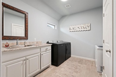 This exquisite four bedroom three bath Al Couto home boasts on Harbor Lakes Golf Club in Texas - for sale on GolfHomes.com, golf home, golf lot