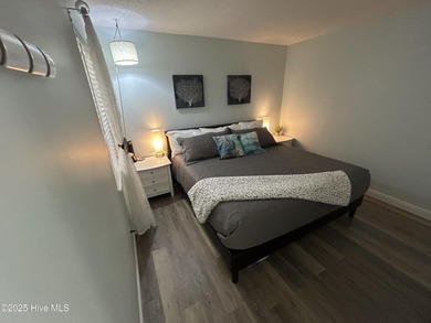 Welcome to this charming 2-bedroom, 2-bathroom coastal condo on Carolina Shores Golf Course in North Carolina - for sale on GolfHomes.com, golf home, golf lot