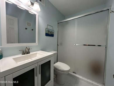 Welcome to this charming 2-bedroom, 2-bathroom coastal condo on Carolina Shores Golf Course in North Carolina - for sale on GolfHomes.com, golf home, golf lot