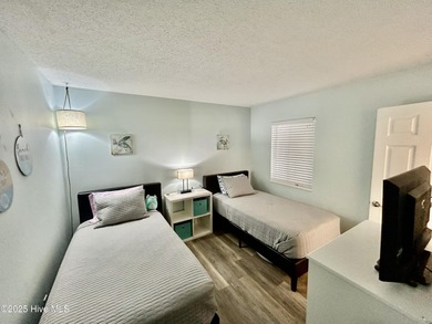 Welcome to this charming 2-bedroom, 2-bathroom coastal condo on Carolina Shores Golf Course in North Carolina - for sale on GolfHomes.com, golf home, golf lot