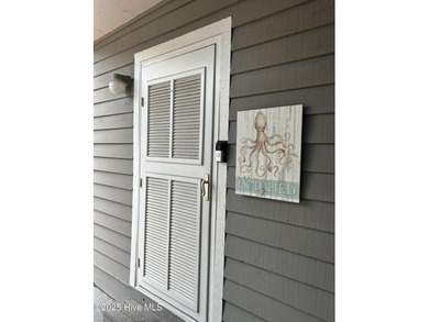 Welcome to this charming 2-bedroom, 2-bathroom coastal condo on Carolina Shores Golf Course in North Carolina - for sale on GolfHomes.com, golf home, golf lot