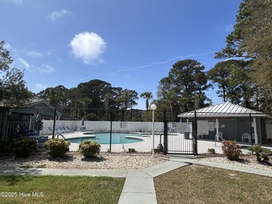 Welcome to this charming 2-bedroom, 2-bathroom coastal condo on Carolina Shores Golf Course in North Carolina - for sale on GolfHomes.com, golf home, golf lot