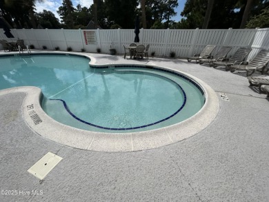 Welcome to this charming 2-bedroom, 2-bathroom coastal condo on Carolina Shores Golf Course in North Carolina - for sale on GolfHomes.com, golf home, golf lot