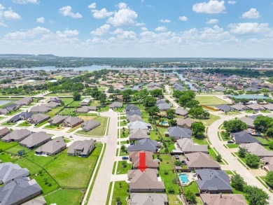 This exquisite four bedroom three bath Al Couto home boasts on Harbor Lakes Golf Club in Texas - for sale on GolfHomes.com, golf home, golf lot
