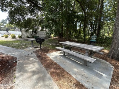 Welcome to this charming 2-bedroom, 2-bathroom coastal condo on Carolina Shores Golf Course in North Carolina - for sale on GolfHomes.com, golf home, golf lot