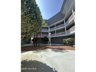 Welcome to this charming 2-bedroom, 2-bathroom coastal condo on Carolina Shores Golf Course in North Carolina - for sale on GolfHomes.com, golf home, golf lot