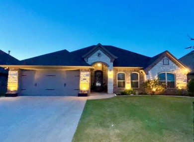 This exquisite four bedroom three bath Al Couto home boasts on Harbor Lakes Golf Club in Texas - for sale on GolfHomes.com, golf home, golf lot