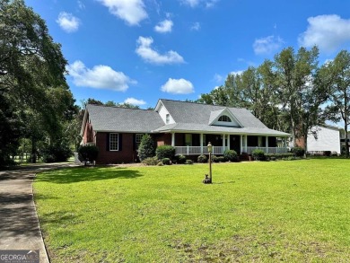 Imagine mornings on your spacious covered front porch or on Okefenokee Country Club in Georgia - for sale on GolfHomes.com, golf home, golf lot