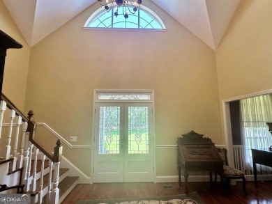 Imagine mornings on your spacious covered front porch or on Okefenokee Country Club in Georgia - for sale on GolfHomes.com, golf home, golf lot