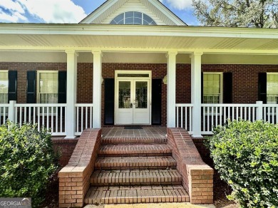 Imagine mornings on your spacious covered front porch or on Okefenokee Country Club in Georgia - for sale on GolfHomes.com, golf home, golf lot