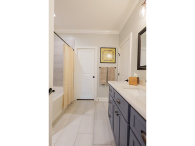 Welcome to 4116 Eileen Court, where timeless design meets on Kinderlou Forest Golf Club in Georgia - for sale on GolfHomes.com, golf home, golf lot