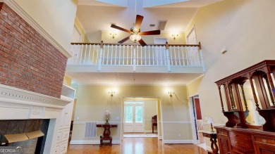 Imagine mornings on your spacious covered front porch or on Okefenokee Country Club in Georgia - for sale on GolfHomes.com, golf home, golf lot