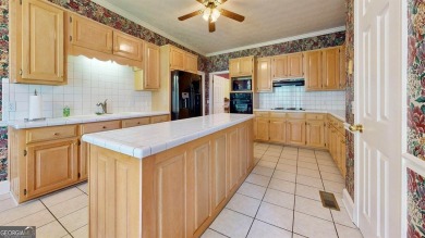 Imagine mornings on your spacious covered front porch or on Okefenokee Country Club in Georgia - for sale on GolfHomes.com, golf home, golf lot