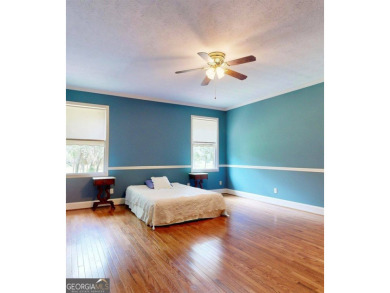 Imagine mornings on your spacious covered front porch or on Okefenokee Country Club in Georgia - for sale on GolfHomes.com, golf home, golf lot