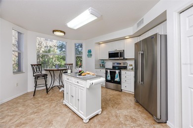 Welcome to this light and bright corner condo-home featuring an on East Bay Golf Club in Florida - for sale on GolfHomes.com, golf home, golf lot