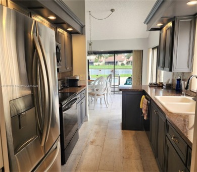 This stunning Mediterranean/Spanish-style home embodies elegance on Bear Lakes Country Club in Florida - for sale on GolfHomes.com, golf home, golf lot