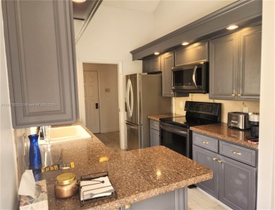 This stunning Mediterranean/Spanish-style home embodies elegance on Bear Lakes Country Club in Florida - for sale on GolfHomes.com, golf home, golf lot