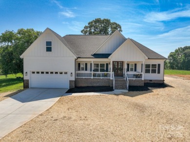 Fabulous golf course home featuring impressive vaulted ceiling on Woodbridge Golf Links in North Carolina - for sale on GolfHomes.com, golf home, golf lot