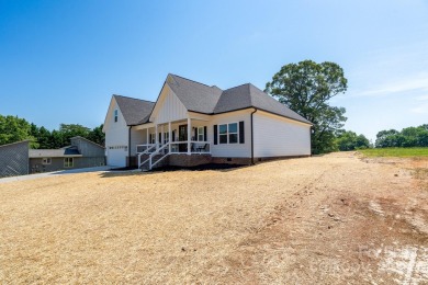 Fabulous golf course home featuring impressive vaulted ceiling on Woodbridge Golf Links in North Carolina - for sale on GolfHomes.com, golf home, golf lot