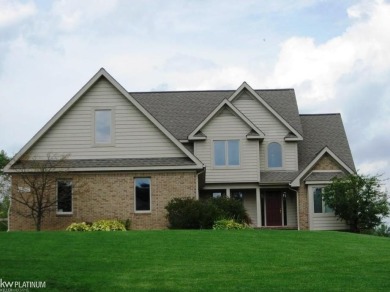 This 5 bedroom home located in a tranquil setting on over 1.5 on Springfield Oaks Golf Course in Michigan - for sale on GolfHomes.com, golf home, golf lot