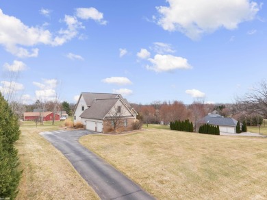 This 5 bedroom home located in a tranquil setting on over 1.5 on Springfield Oaks Golf Course in Michigan - for sale on GolfHomes.com, golf home, golf lot