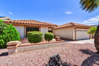 This Camelback model with vaulted ceilings and enclosed patio on Westbrook Village Golf Club in Arizona - for sale on GolfHomes.com, golf home, golf lot