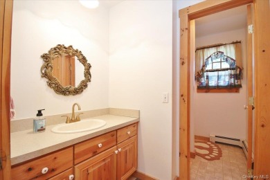 This unique Cape Cod is located in the Gottscheer Country Club on Osiris Country Club in New York - for sale on GolfHomes.com, golf home, golf lot