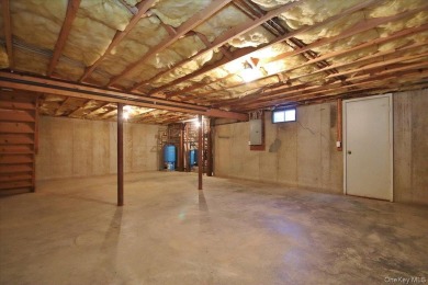 This unique Cape Cod is located in the Gottscheer Country Club on Osiris Country Club in New York - for sale on GolfHomes.com, golf home, golf lot