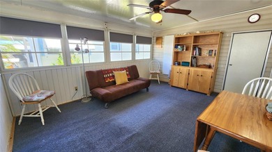 CHEERFUL, WELL-KEPT MOBILE HOME IN ACTIVE 55+ FLORIDA COMMUNITY! on River Run Golf Links in Florida - for sale on GolfHomes.com, golf home, golf lot