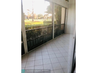 55+ adult community. *CONVENIENT 1ST FLOOR CORNER UNIT WITH on Woodlands Country Club in Florida - for sale on GolfHomes.com, golf home, golf lot