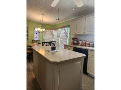This beautiful 2-bedroom, 2-bath split-floor plan home is on Pine Lakes Country Club in Florida - for sale on GolfHomes.com, golf home, golf lot