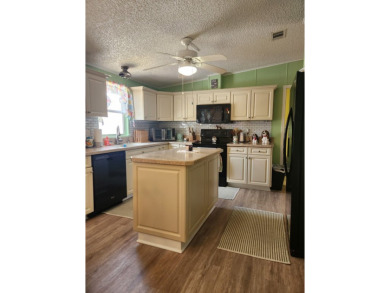 This beautiful 2-bedroom, 2-bath split-floor plan home is on Pine Lakes Country Club in Florida - for sale on GolfHomes.com, golf home, golf lot