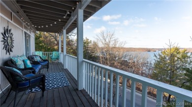 Lovely home with an amazing view of the lake.  Totally turn key on The Oaks Golf Course in Missouri - for sale on GolfHomes.com, golf home, golf lot