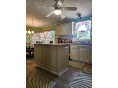 This beautiful 2-bedroom, 2-bath split-floor plan home is on Pine Lakes Country Club in Florida - for sale on GolfHomes.com, golf home, golf lot