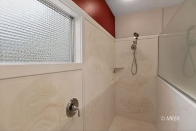 Welcome home to this inviting single-level residence located in on The Oasis Golf Club in Nevada - for sale on GolfHomes.com, golf home, golf lot