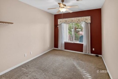 Welcome home to this inviting single-level residence located in on The Oasis Golf Club in Nevada - for sale on GolfHomes.com, golf home, golf lot