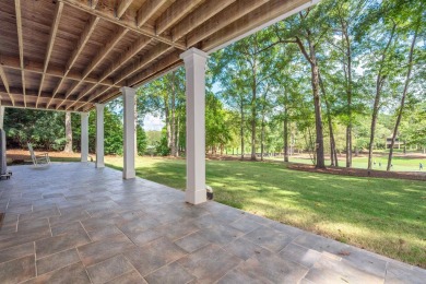 Perched above the green on the Jack Nicolas signature 5th hole on Great Waters Course At Reynolds Plantation in Georgia - for sale on GolfHomes.com, golf home, golf lot